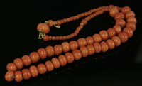 Lot 401 - A single row graduated coral bead necklace