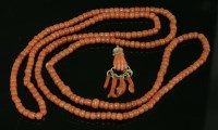 Lot 404 - A single row uniform coral bead necklace