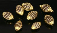 Lot 513 - A small collection of seven Indian high carat gold oval beads