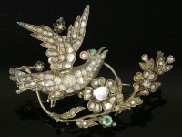 Lot 369 - A diamond and gem set bird on a bough brooch