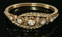 Lot 384 - A Victorian diamond set gold hinged bangle