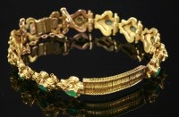 Lot 323 - A Victorian gold and emerald bracelet