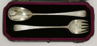 Lot 132 - A pair of George III silver old english pattern salad servers