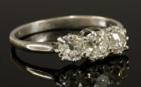 Lot 570 - A three stone diamond ring