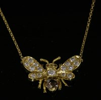 Lot 588 - An 18ct gold diamond set butterfly pendant