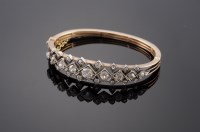 Lot 383 - A cased late Victorian diamond set hinged bangle