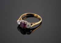 Lot 472 - A ruby and diamond three stone ring