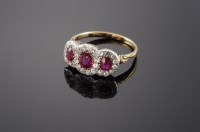 Lot 443 - An Edwardian ruby and diamond triple cluster ring