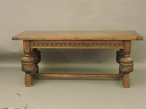 Lot 605 - A reproduction oak refectory table