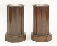 Lot 364 - A pair of mahogany cylindrical fluted pedestal pot cupboards