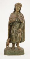 Lot 88 - A carved figure of a beggar