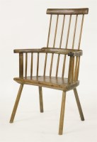 Lot 351 - A rustic stick back armchair