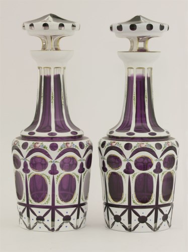Lot 52 - A pair of Bohemian overlaid purple glass decanters and stoppers