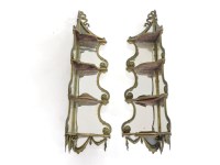 Lot 367 - A pair of French four-tier corner gilt brass corner shelves