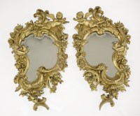 Lot 466 - A pair of Florentine carved giltwood wall mirrors