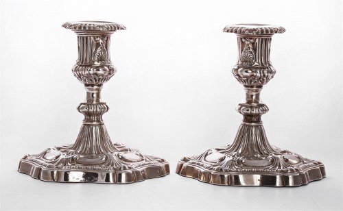 Lot 97 - A pair of George III silver candlesticks