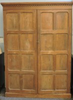 Lot 757 - A large 20th century oak cupboard