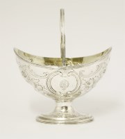 Lot 97 - A George III silver swing-handled sugar basket