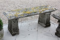 Lot 940 - A reconstituted stone garden bench
