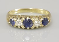 Lot 77 - An 18ct gold sapphire and diamond five stone ring