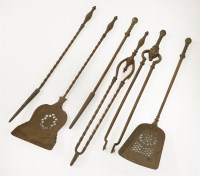 Lot 239 - Two sets of three iron fire tools