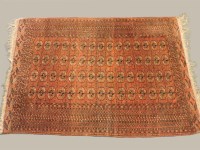 Lot 570 - Three Turkoman style red ground rugs