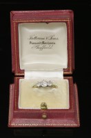 Lot 506 - A graduated three stone diamond ring