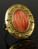 Lot 490 - A Continental carved coral gold ring