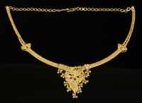 Lot 523 - An Indian high carat gold and enamel necklace