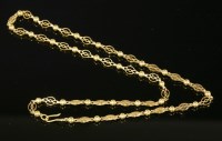 Lot 525 - An Indian high carat gold bead and pierced fretwork oval link chain