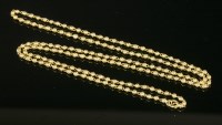 Lot 526 - An Indian high carat gold hollow bead link necklace