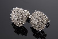 Lot 558 - A pair of white gold diamond set cluster earrings