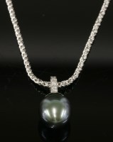 Lot 555 - A white gold Tahitian cultured pearl and diamond pendant