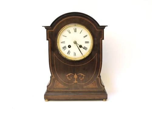 Lot 302 - An early 20th century inlaid mahogany mantle clock