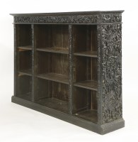 Lot 452 - A 19th century Chinese carved oak open bookshelf