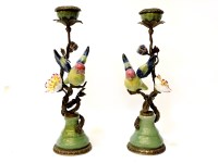 Lot 129 - A pair of ceramic and cast metal candlesticks