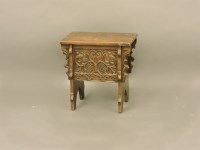 Lot 442 - A 17th century style carved oak boarded chest of small proportions