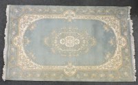 Lot 539 - An Oriental blue ground rug