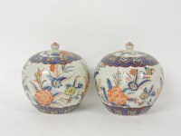 Lot 311 - A pair of Chinese vases and covers