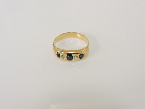 Lot 6 - A gold five stone sapphire and diamond ring