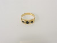 Lot 6 - A gold five stone sapphire and diamond ring