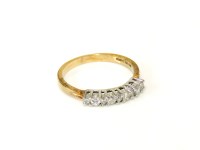 Lot 11 - A 9ct gold diamond set half eternity ring
