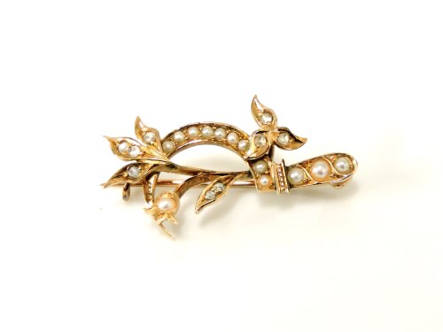 Lot 13 - A gold rose cut diamond and split pearl scythe and floral spray brooch