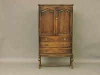 Lot 448 - A 1920's oak cupboard