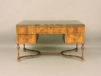 Lot 393 - A 1920s Queen Anne style walnut desk