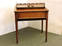 Lot 465 - A 1920s oak revolving drinks table