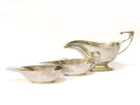 Lot 102 - A pair of silver sauceboats