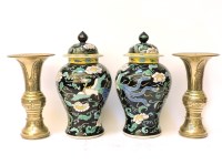 Lot 265 - A pair of famille noir style vases and covers