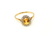 Lot 29 - A gold citrine and diamond cluster ring