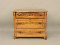 Lot 413 - A Victorian walnut serpentine chest of three drawers